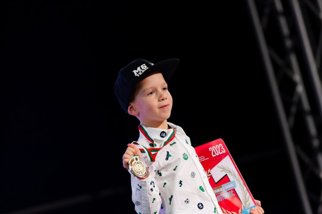 Radi with a medal at an awards ceremony, 2023