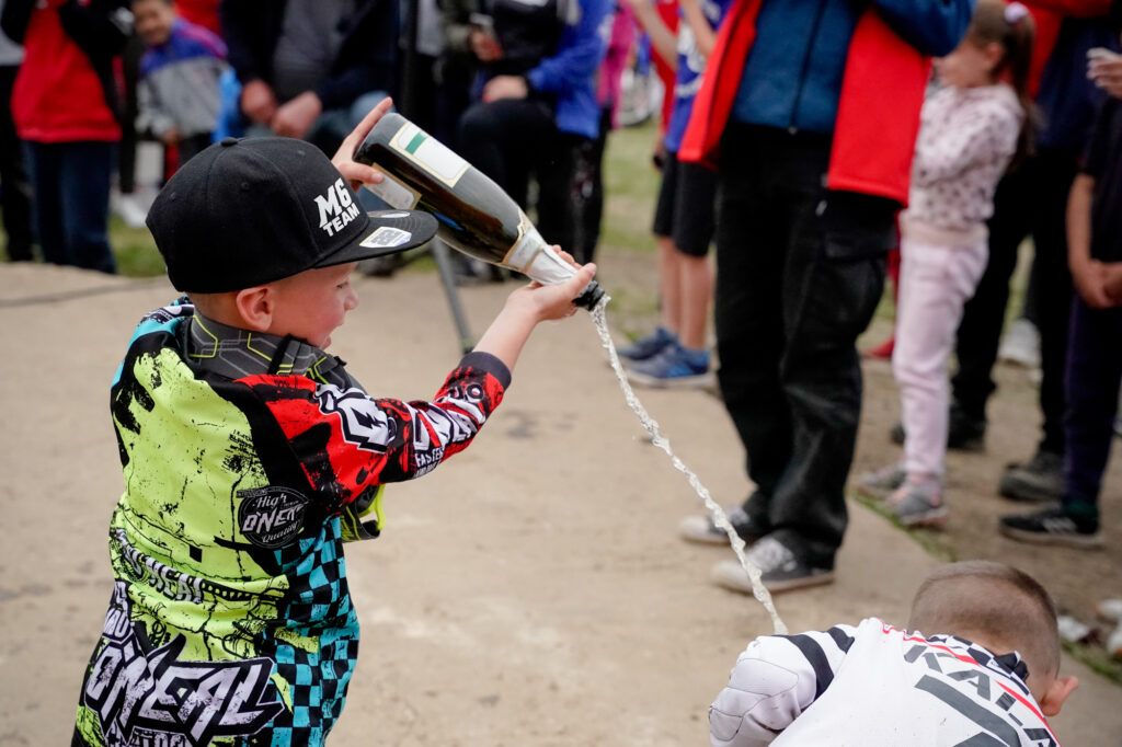 Radi celebrates the win with champagne