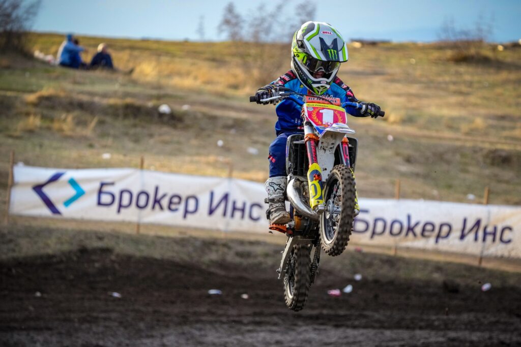 Radi (#22) jumping with the front wheel up, 2023