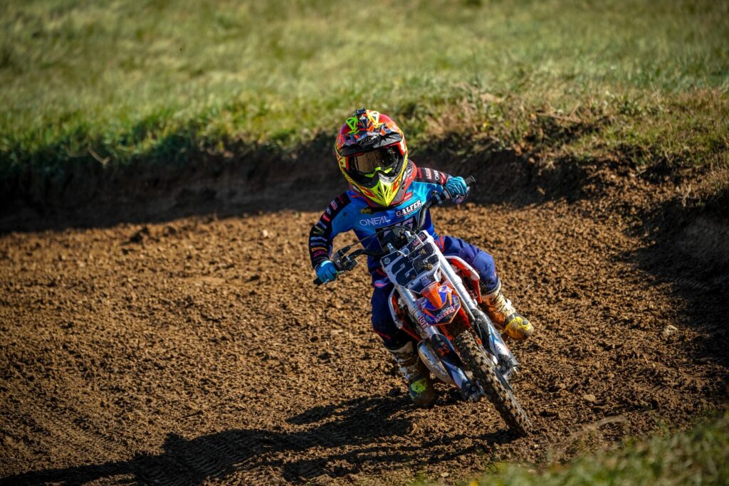Radi (#22) cornering on the motocross track, 2022