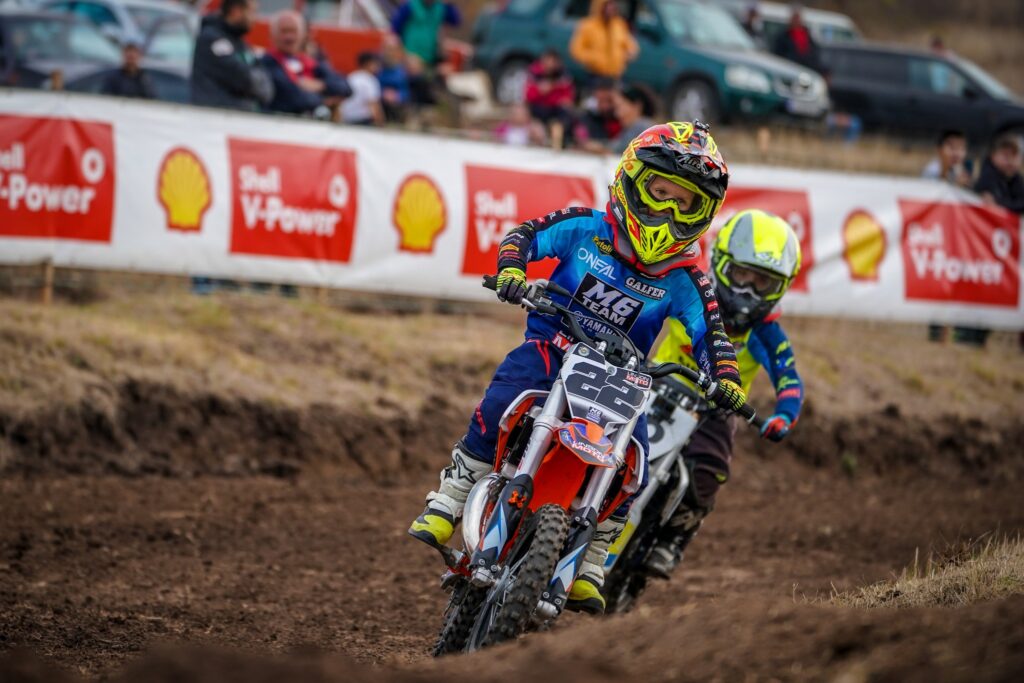 Radi (#22) leads another rider through a corner, 2022